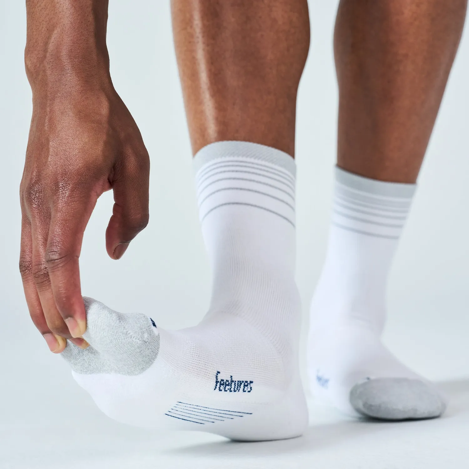 Feetures Elite Light Cushion Reflective Mini Crew sokker hvit refleks
